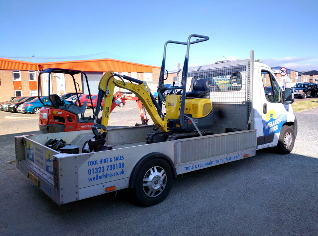 Weller Hire delivery flatbed truck – Large plant and machinery transport.